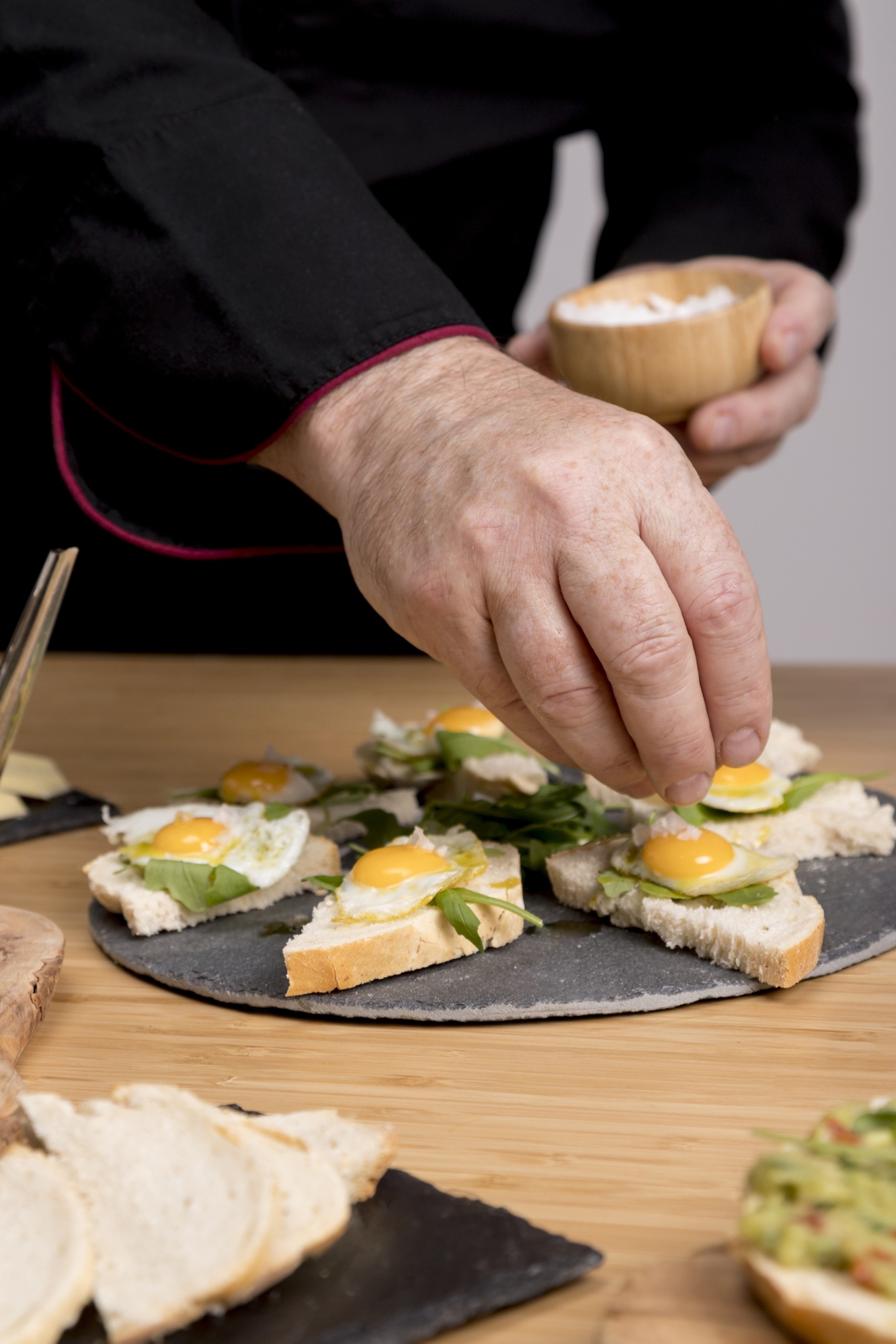 Portrait of a chef arranging canapés